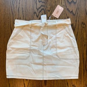 white denim mini skirt with contrast stitching